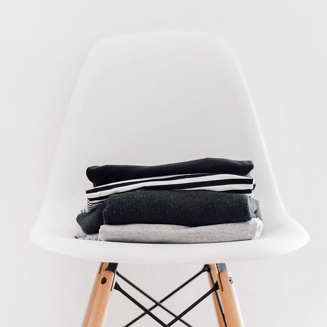 Folded neutral garments showing a range of soft textures